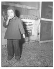 Young child standing in front of store 